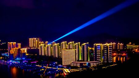 View of the night city of Sanya. Hainan Island, China. Neon lights of the night metropolisの写真素材