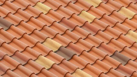 The roof is covered with red tiles. Backgroundの写真素材