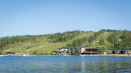 Finland - July 29, 2018. Ukkohalla Ski Resort is located in Central Finland, the Kainuu region. The most environmentally friendly air. A lake in the middle of a forest. Cozy picturesque cottagesのeditorial素材