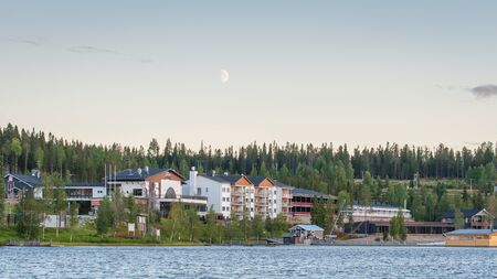 Finland - August 19, 2018. Ukkohalla Ski Resort is located in Central Finland, the Kainuu region. The most environmentally friendly air. A lake in the middle of a forest. Cozy picturesque cottagesのeditorial素材