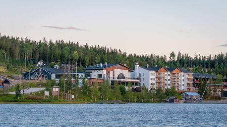 Finland - August 19, 2018. Ukkohalla Ski Resort is located in Central Finland, the Kainuu region. The most environmentally friendly air. A lake in the middle of a forest. Cozy picturesque cottagesのeditorial素材