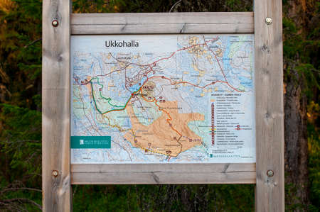 Finland, Ukkohalla - August 1, 2018: wooden information stand with a map of the Ukkohalla ski resortのeditorial素材