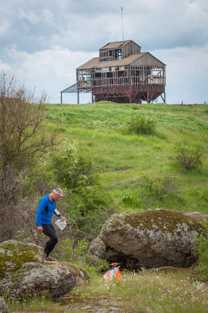 Village of Aktovo, Ukraine - May 21, 2021: Orienteering race. Traditional annual orienteering game Partisan Spark Cup 2021. Athletes during orienteering trailのeditorial素材