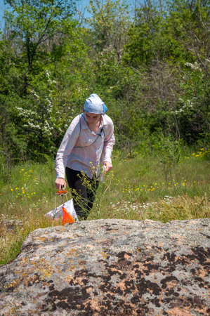 Village Aktovo, Ukraine - May 21, 2021: Orienteering race. Traditional annual game. Athlete during orienteering, checkpointのeditorial素材