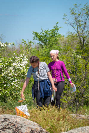 Village Aktovo, Ukraine - May 21, 2021: Orienteering race. Traditional annual game. Athlete during orienteering, checkpointのeditorial素材