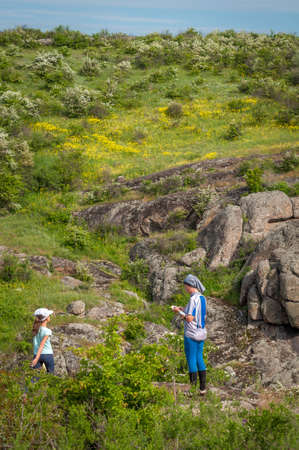 Village Aktovo, Ukraine - May 21, 2021: Orienteering race. Traditional annual game. Young athlete during orienteeringのeditorial素材