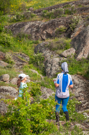 Village Aktovo, Ukraine - May 21, 2021: Orienteering race. Traditional annual game. Young athlete during orienteeringのeditorial素材