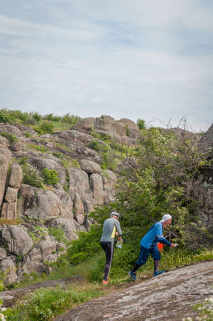 Village Aktovo, Ukraine - May 21, 2021: Orienteering race. Traditional annual game. Athlete during orienteering, checkpointのeditorial素材