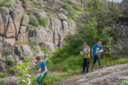 Village Aktovo, Ukraine - May 21, 2021: Orienteering race. Traditional annual game. Athlete during orienteering, checkpointのeditorial素材
