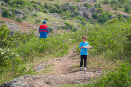 Village Aktovo, Ukraine - May 21, 2021: Orienteering race. Traditional annual game. Young athlete during orienteeringのeditorial素材
