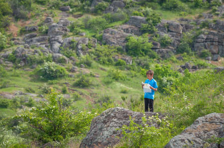 Village Aktovo, Ukraine - May 21, 2021: Orienteering race. Traditional annual game. Young athlete during orienteeringのeditorial素材