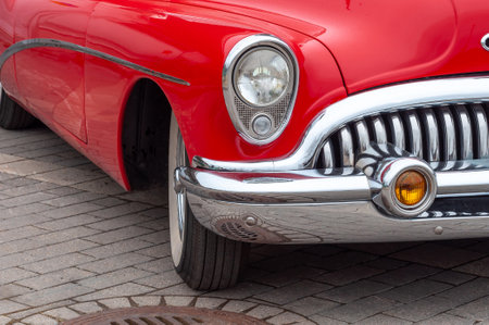 Red retro car. Front part, bumper, headlightの写真素材