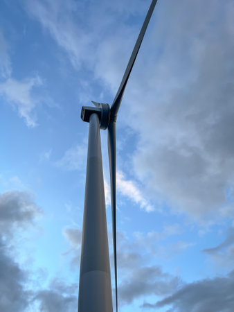 Close-up of wind turbine against blue sky. Concept of green, clean, renewable energy.の写真素材