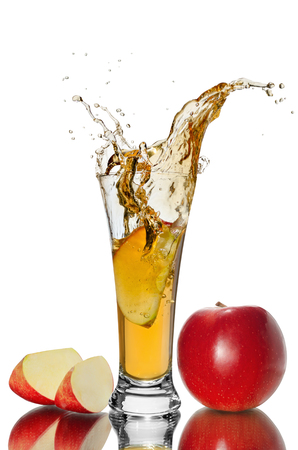 the slices of Apple falling into a glass of juice, red Appleの写真素材