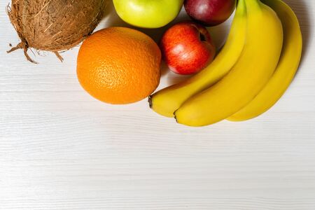Assortment of exotic fruits on white wooden tableの写真素材