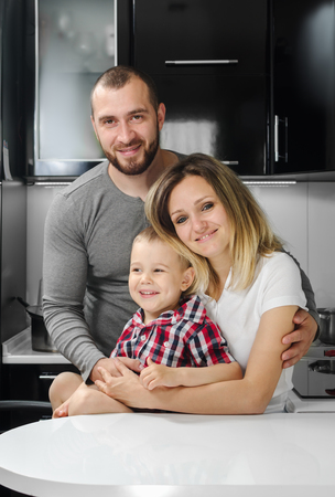 happy family mother, father, child at homeの写真素材