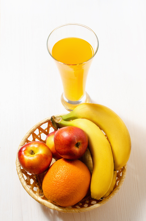 citrus juice with fruits on a white wooden table, view from topの写真素材