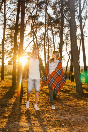 young loving couple walking in the park holding handsの写真素材