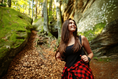 Active healthy woman hiking in beautiful forest.の写真素材