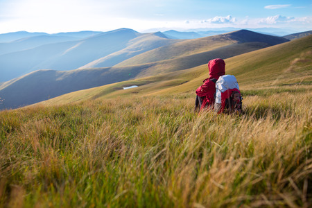 Shot of a young woman looking at the landscape while hiking in the mountainsの写真素材