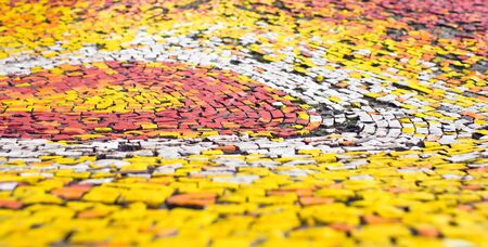 The surface of an unusual shape is laid out of a multi colored mosaicの写真素材