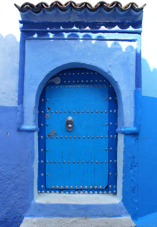 Traditional and artisanal door in Moroccoの写真素材