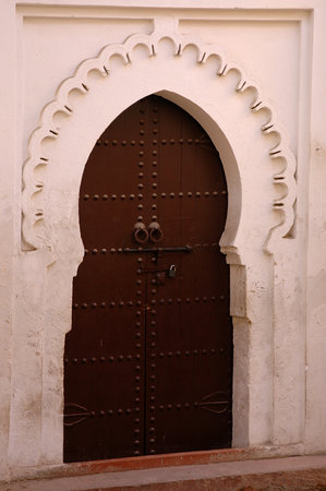 Traditional and artisanal door in Moroccoの写真素材