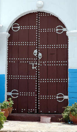 Traditional and artisanal door in Moroccoの写真素材