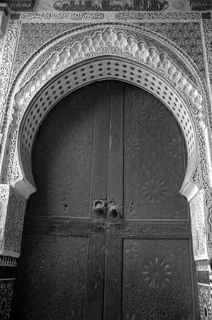 The traditional and handcrafted door in Morocco in black and whiteの写真素材