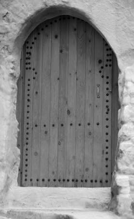 The traditional and handcrafted door in Morocco in black and whiteの写真素材