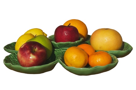 Fruit apples,grapefruits,oranges,lemons on a plate isolated on a white background の写真素材