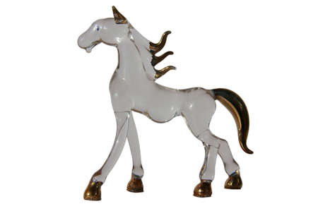 Glass clear horse with brown mane isolated a white background.の写真素材