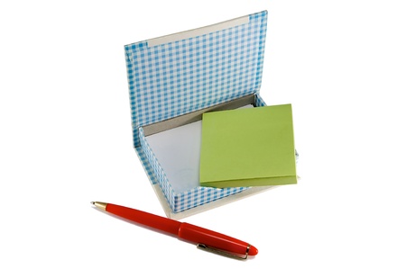 Stack paper and a red pen isolated on a white background.の写真素材