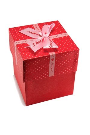 Gift red box with bow isolated on a white background.の写真素材