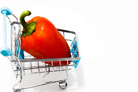 Shopping Cart with red pepper Isolated On White.Shopping concept. Copy space.の写真素材