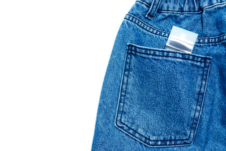 Blue jeans with parfume in pocket in white background.の写真素材