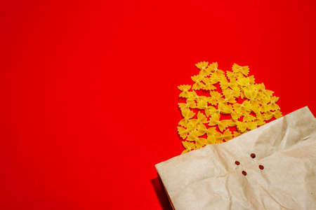 Italian pasta with paper bag isolated. Supermarket shopping concept. Online delivery.Close upの写真素材