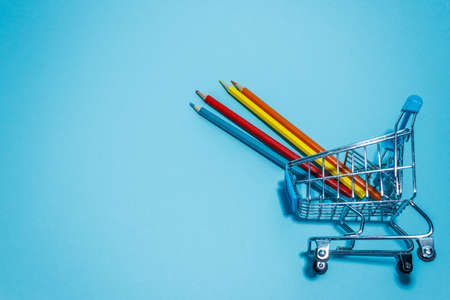 Colorful pencils on mini supermarket cart. Four pencils on cartの写真素材