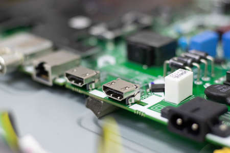 Electronic components. Focus in the HDMI connector. Blur background. Electronic circuit board close...