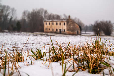 Snowy landscape with an old uninhabited country house, Veneto, Italyの写真素材