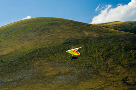 Hang glider just after launch from Monte Cucco Regional Park, Umbria, Italy