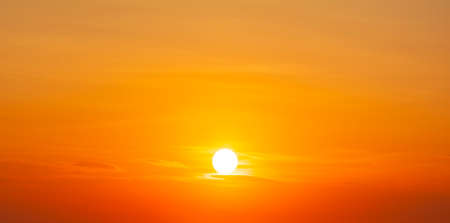 Setting sun in the orange sky. No land view.の写真素材