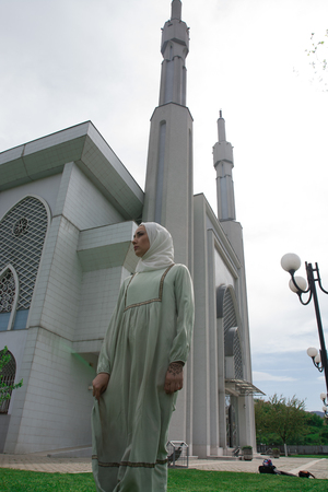 Muslim woman in front of mosqueの写真素材