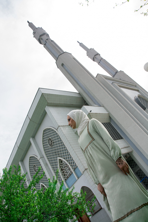 Muslim young girl in front of mosqueの写真素材