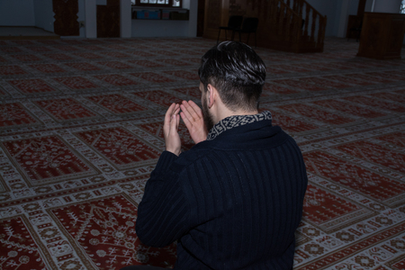 Muslim man praying in mosqueの写真素材