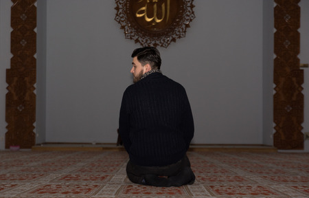 Muslim man praying in mosqueの写真素材
