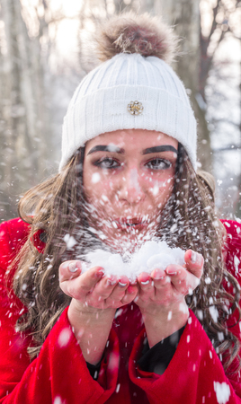 Girl playing with snow