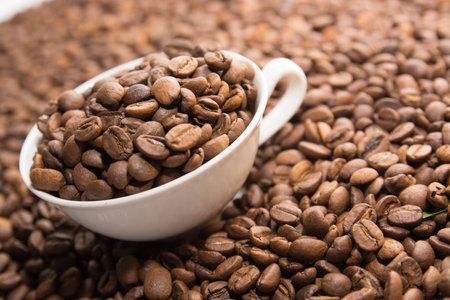 Cup with beans isolatedの写真素材