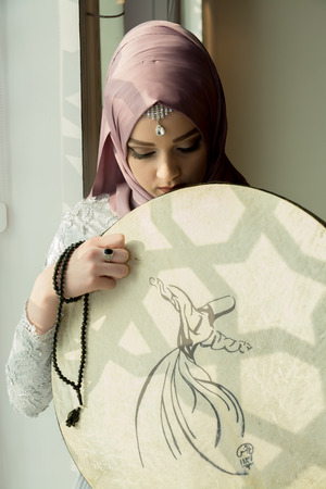 Muslim woman with sufi instrumentの写真素材