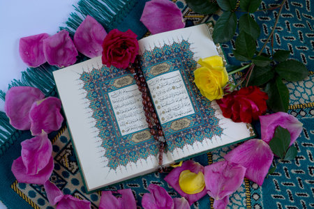 Quran with tasbih and roses on white backgroundの写真素材